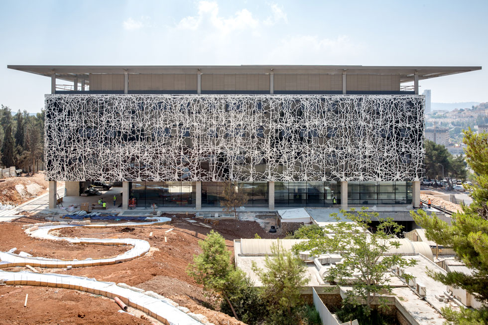 a large building with a fountain in front of it