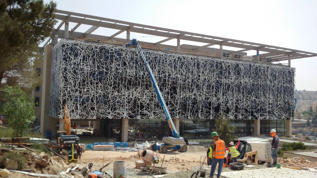 a group of people working on a building under construction