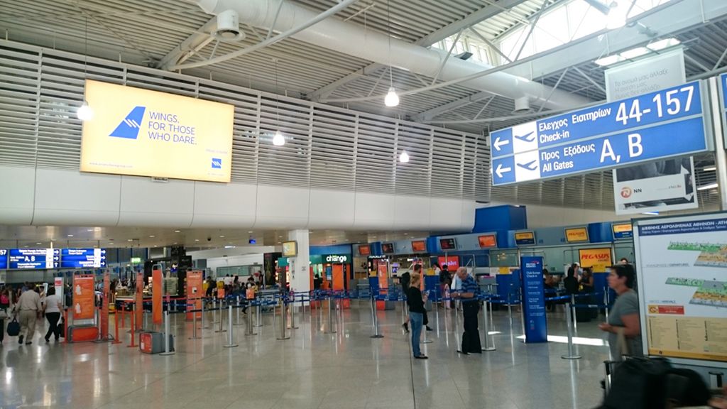 a large airport terminal with people