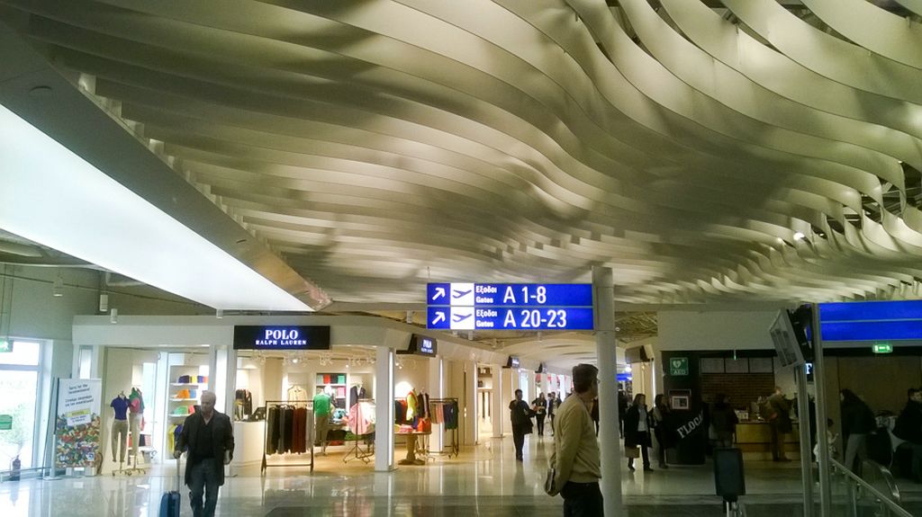 a large room with people and signs