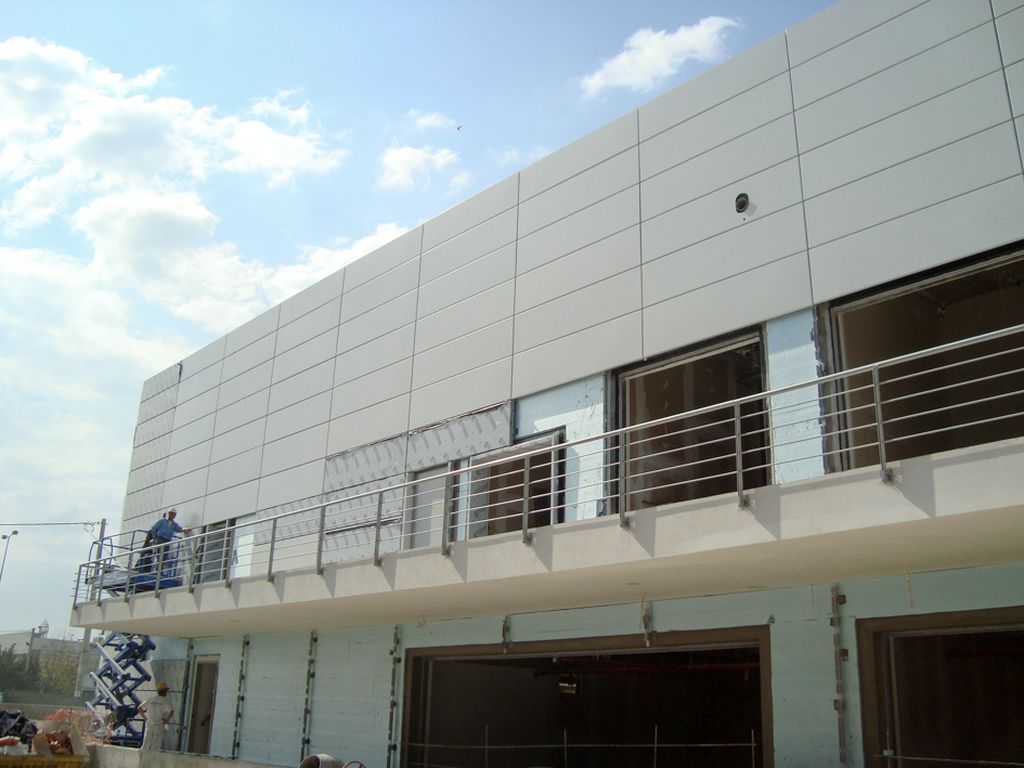 a building with a person standing on the roof